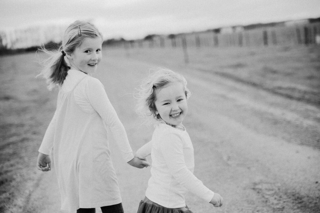 Two girls running, black and white